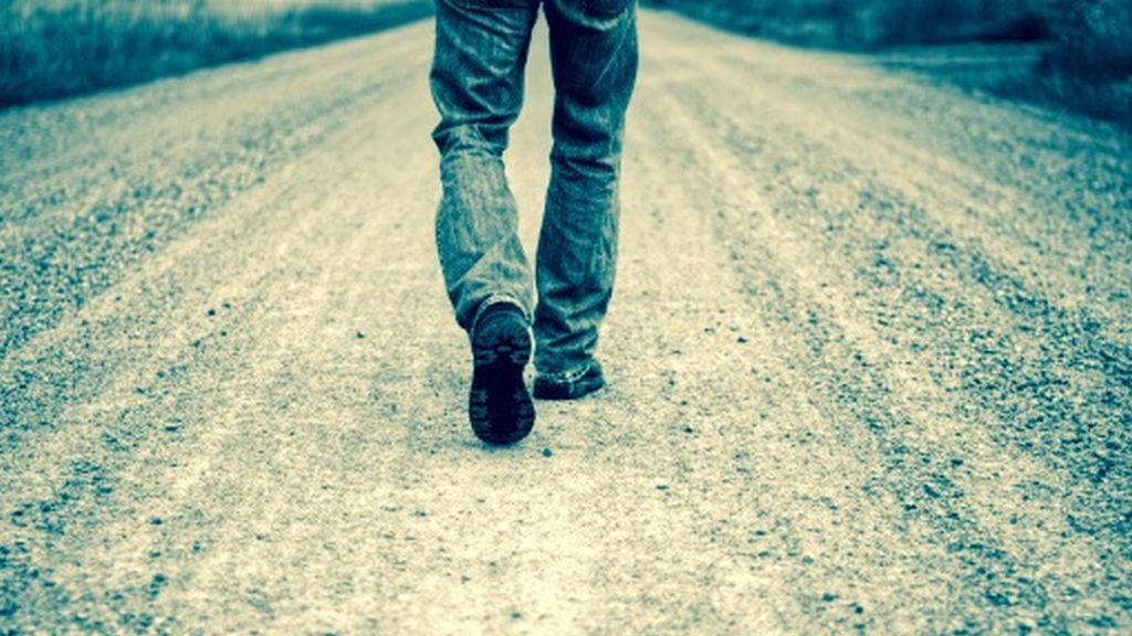 Man walking on road